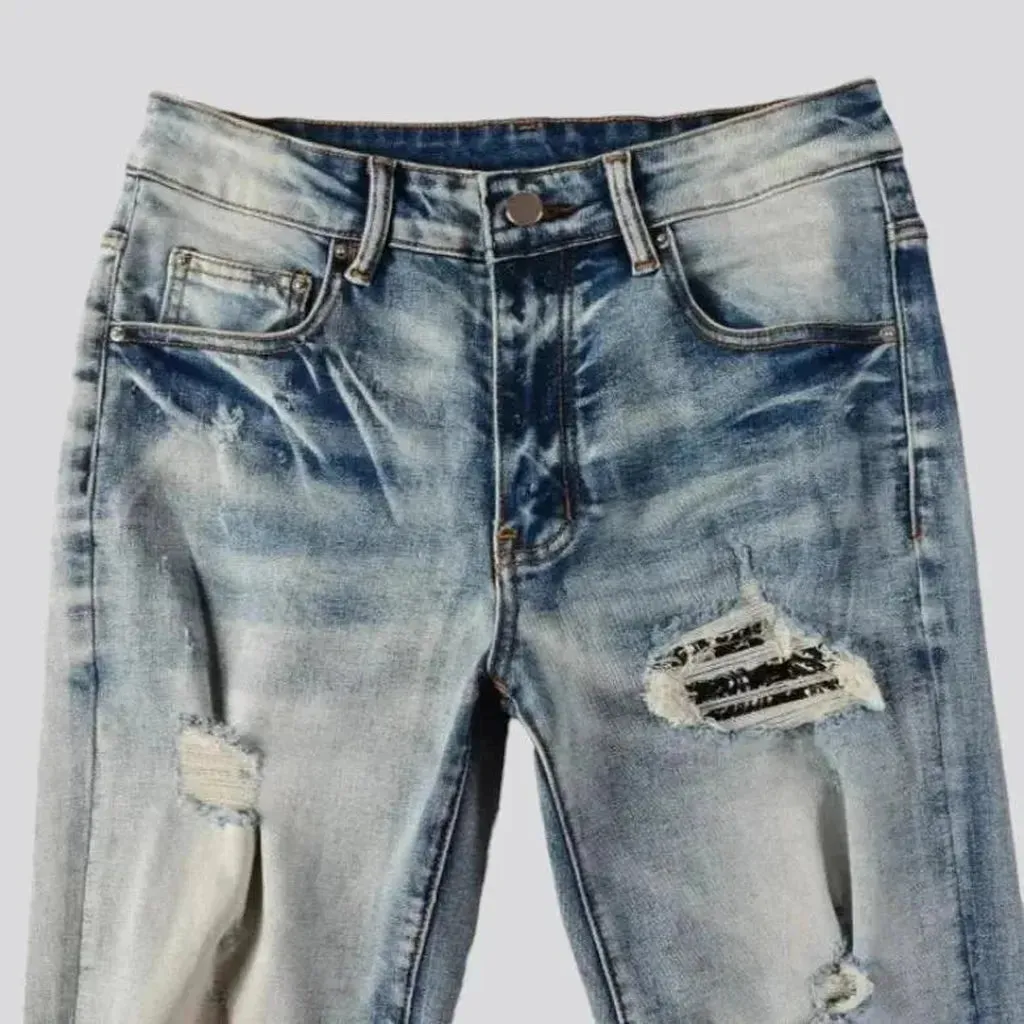 Patchwork men's whiskered jeans