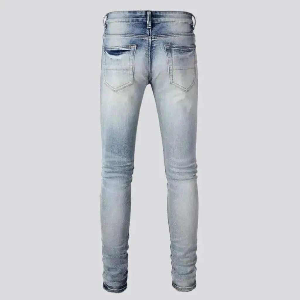 Patchwork men's whiskered jeans