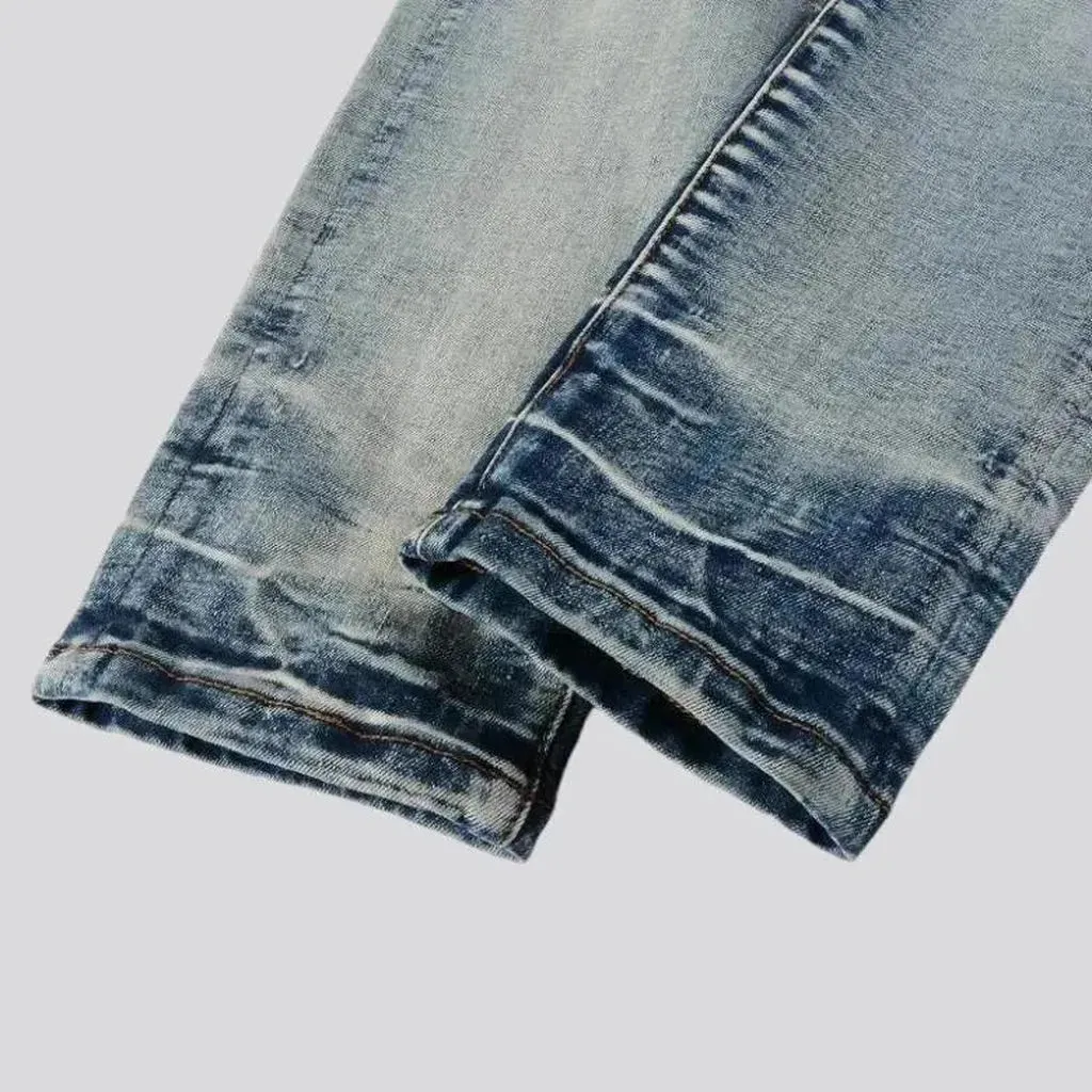 Patchwork men's whiskered jeans